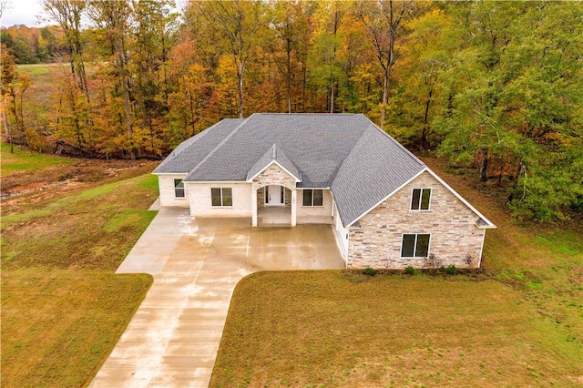 101 Tall Ship Dr, Anderson, SC 29625 - view of front of property with a wooded view, a front yard, driveway, and stone siding