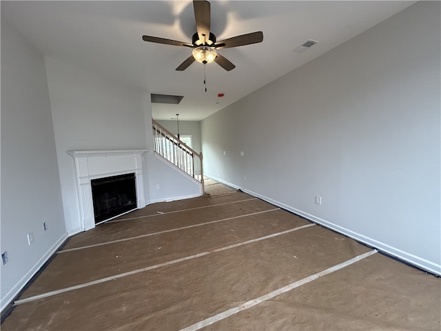 unfurnished living room featuring ceiling fan