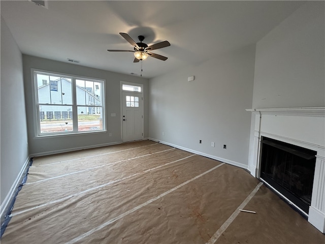 unfurnished living room with ceiling fan