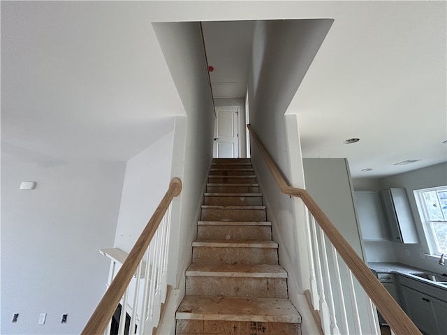 staircase featuring sink