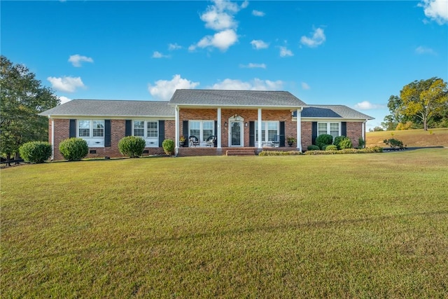 ranch-style home with a front lawn