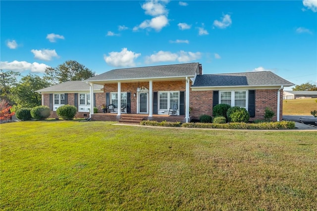 ranch-style home featuring a porch and a front lawn