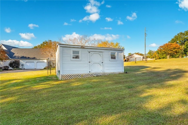 view of outbuilding featuring a yard