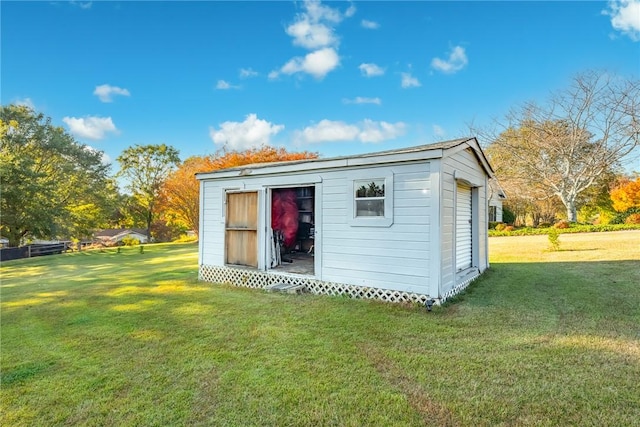 view of outbuilding featuring a yard