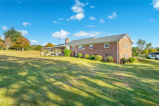 back of house featuring a lawn