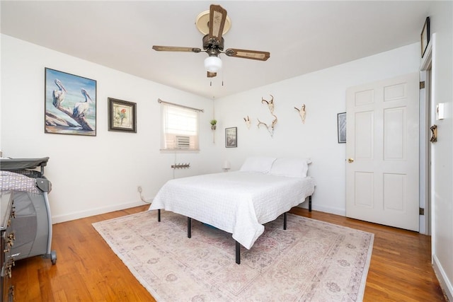 bedroom featuring ceiling fan and wood-type flooring