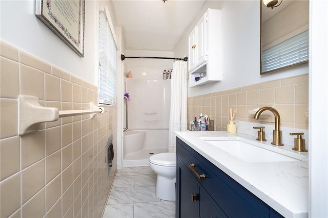 bathroom featuring toilet, a shower with shower curtain, and tile walls