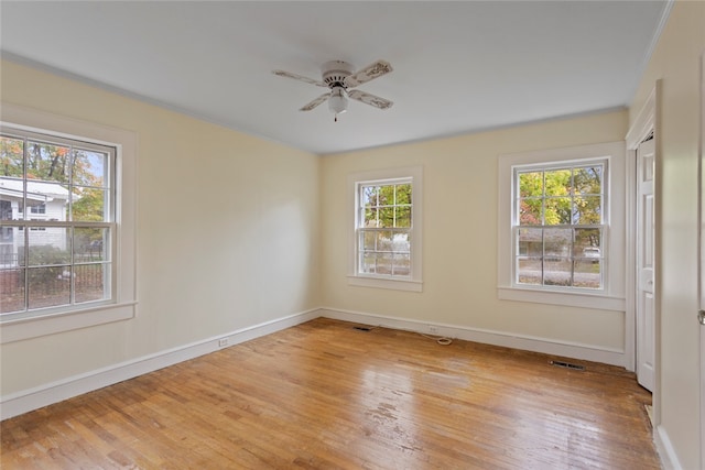 spare room featuring ceiling fan and light wood-type flooring