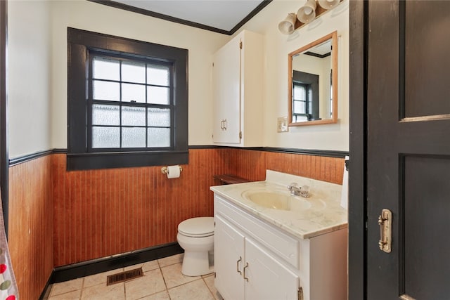 bathroom featuring ornamental molding, tile patterned flooring, vanity, and toilet