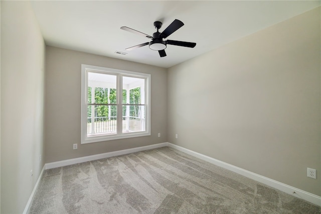 carpeted empty room with ceiling fan