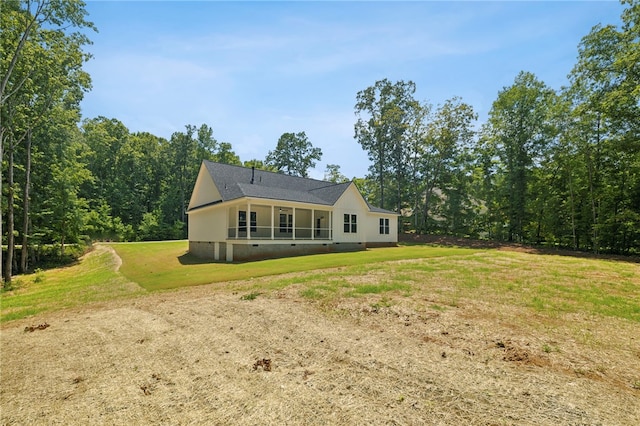 rear view of house with a lawn