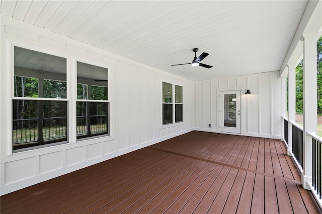 wooden terrace featuring ceiling fan