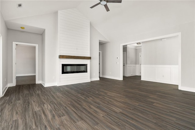 unfurnished living room with ceiling fan, high vaulted ceiling, dark wood-type flooring, and a fireplace