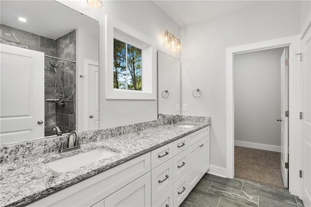 bathroom featuring vanity and a tile shower