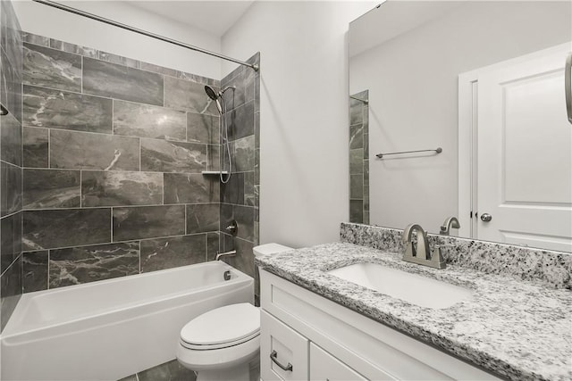 full bathroom with vanity, toilet, and tiled shower / bath