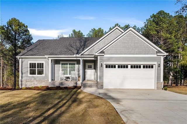 craftsman-style home with a garage and a front yard