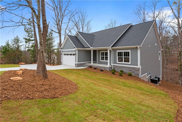 craftsman house with a front yard, central AC, concrete driveway, a garage, and stone siding