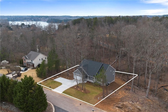 bird's eye view with a view of trees and a water view