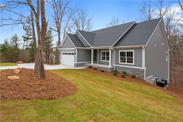 craftsman-style house featuring central air condition unit, a front lawn, stone siding, concrete driveway, and an attached garage