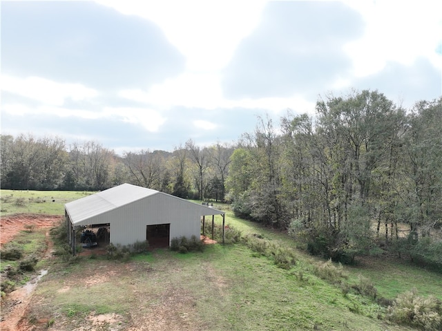 view of property exterior featuring an outbuilding