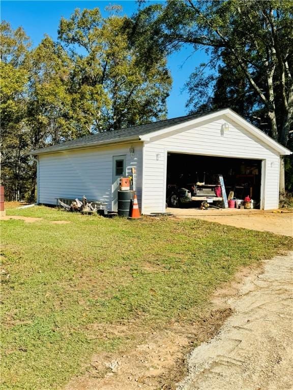 garage with a yard