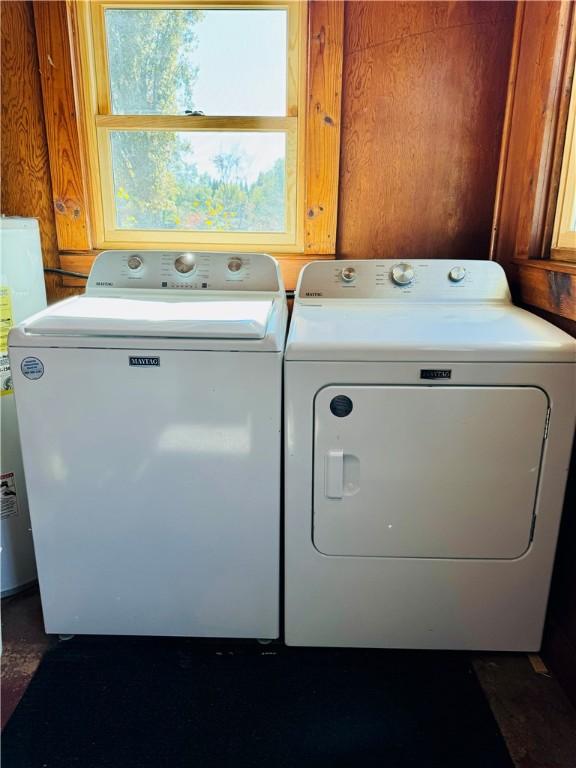 washroom with independent washer and dryer