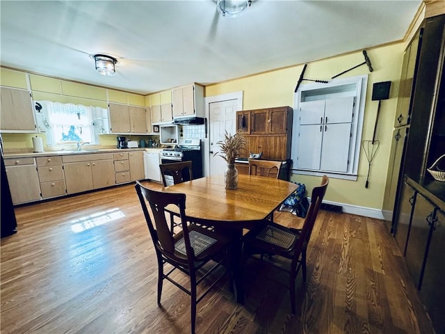 dining room featuring hardwood / wood-style flooring and sink