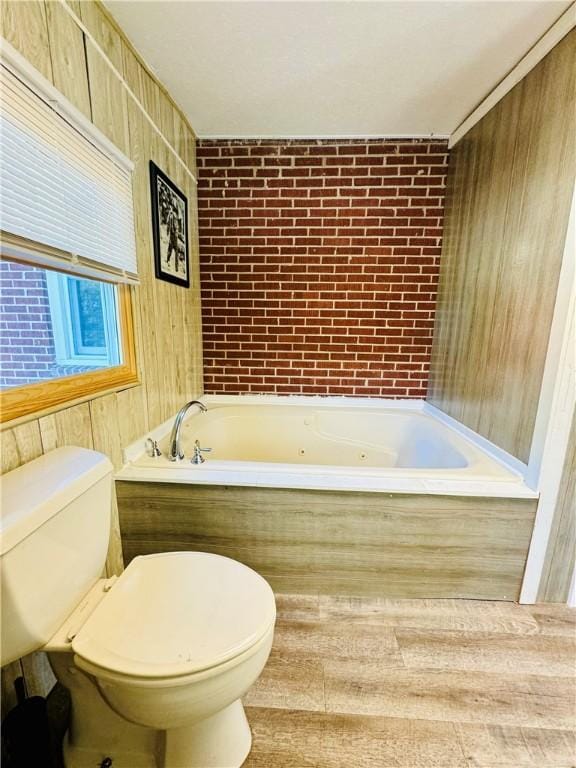 bathroom with a bathing tub and toilet