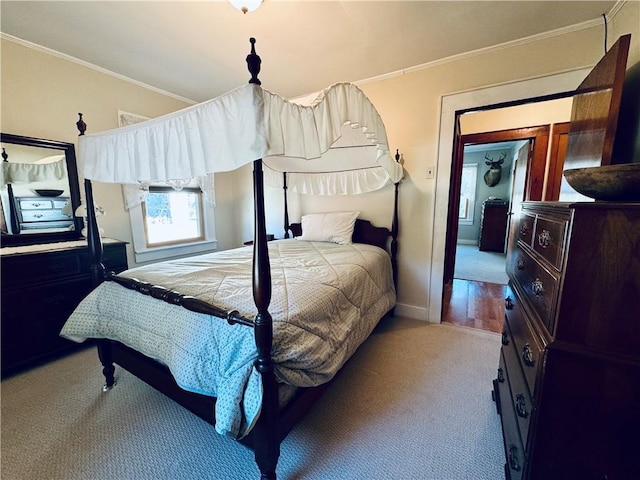 carpeted bedroom with ornamental molding