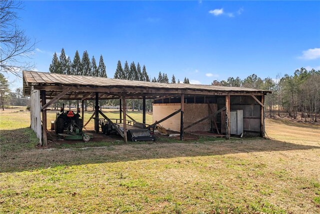 view of pole building with a lawn