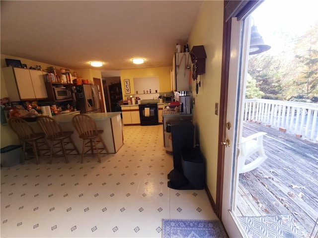 kitchen with stainless steel fridge with ice dispenser and dishwasher