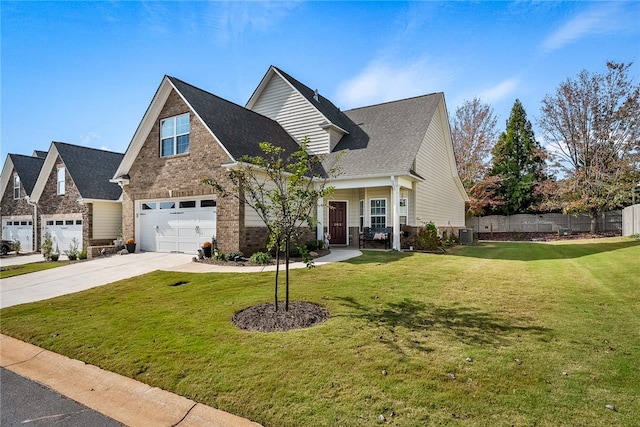 view of front of house featuring a front yard, central AC, a porch, and a garage