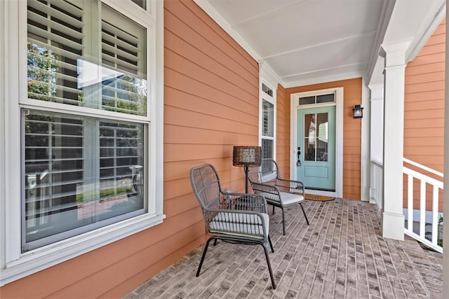 view of exterior entry featuring a porch