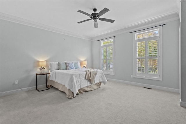 bedroom with light carpet, ceiling fan, and ornamental molding