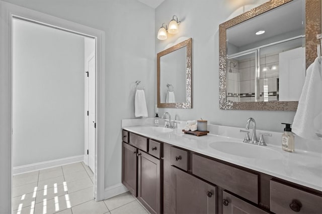 bathroom featuring tile patterned floors, vanity, and walk in shower