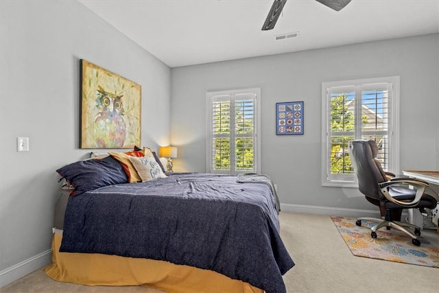 bedroom with ceiling fan and carpet floors