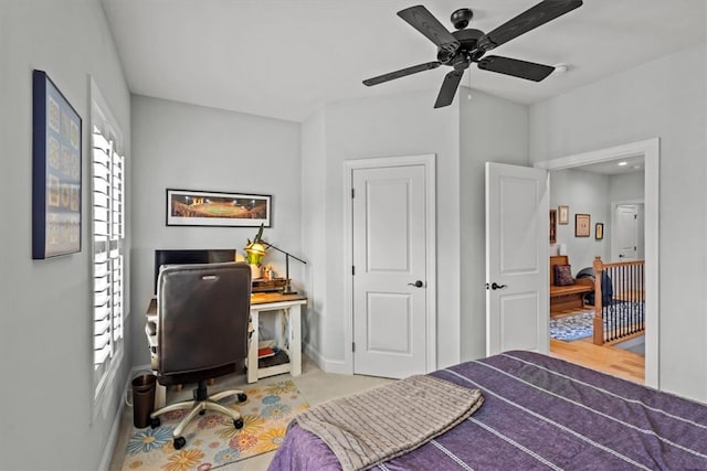 bedroom featuring multiple windows, ceiling fan, and light hardwood / wood-style flooring