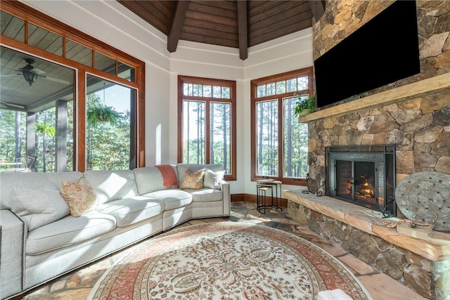 living room with a fireplace and beamed ceiling