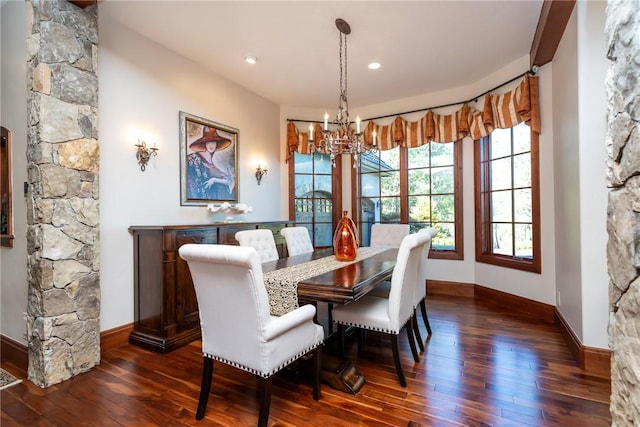 dining space with an inviting chandelier and dark wood-type flooring