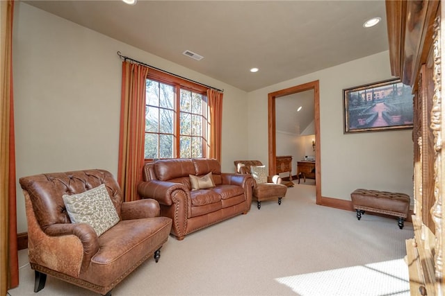 living room featuring carpet and vaulted ceiling