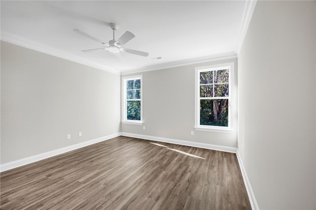 spare room featuring dark hardwood / wood-style floors, ceiling fan, and ornamental molding