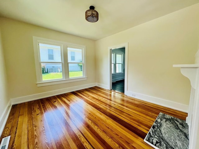 empty room featuring hardwood / wood-style flooring