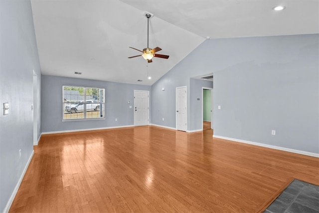 unfurnished living room with ceiling fan, light hardwood / wood-style floors, and high vaulted ceiling