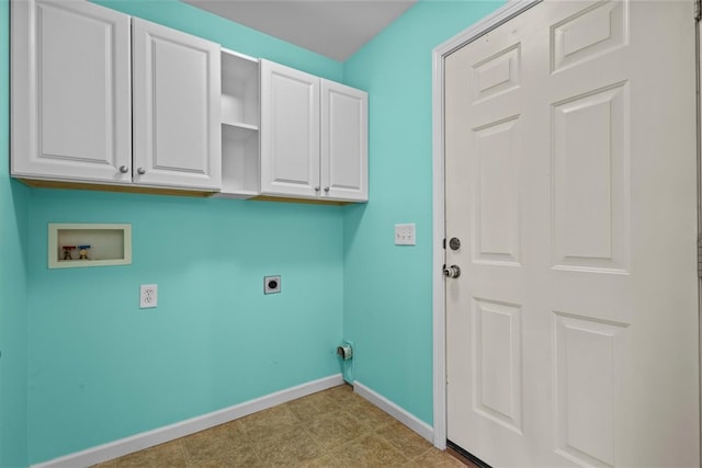 washroom with hookup for an electric dryer, hookup for a washing machine, and cabinets