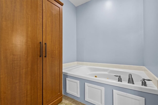 bathroom with a tub to relax in