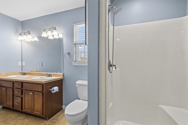 bathroom featuring tile patterned floors, a shower, vanity, and toilet