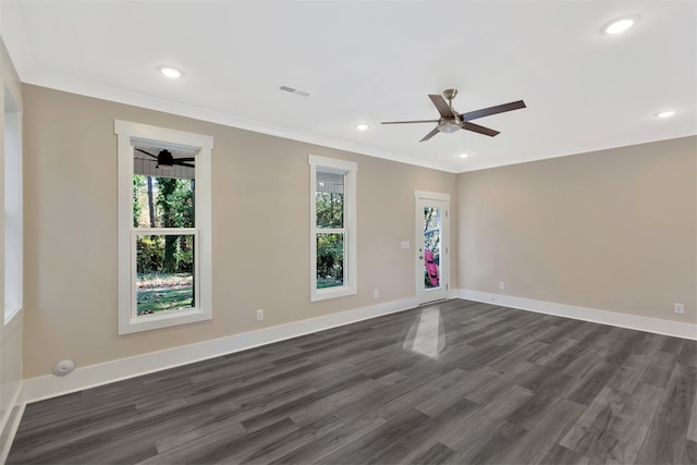 spare room featuring ceiling fan, ornamental molding, and dark wood-type flooring