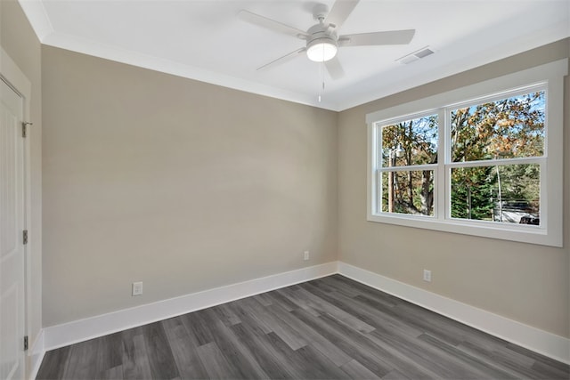 spare room with ornamental molding, ceiling fan, and dark wood-type flooring