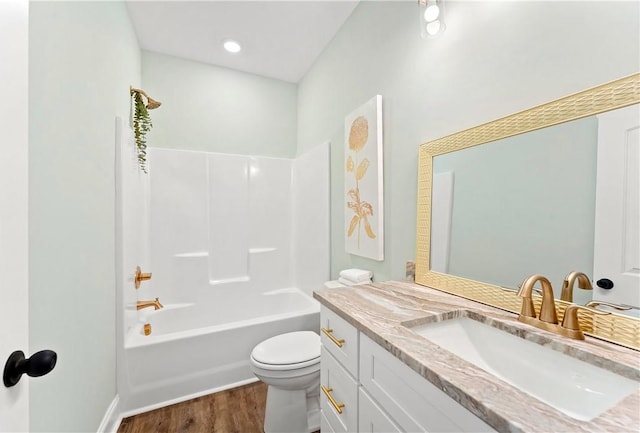 full bathroom featuring shower / bathing tub combination, vanity, toilet, and hardwood / wood-style flooring