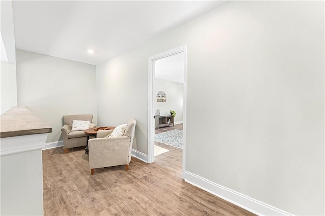 sitting room featuring light hardwood / wood-style floors